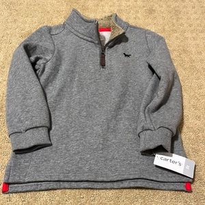 NWT.  Boys size 5T pull over by Carter’s.